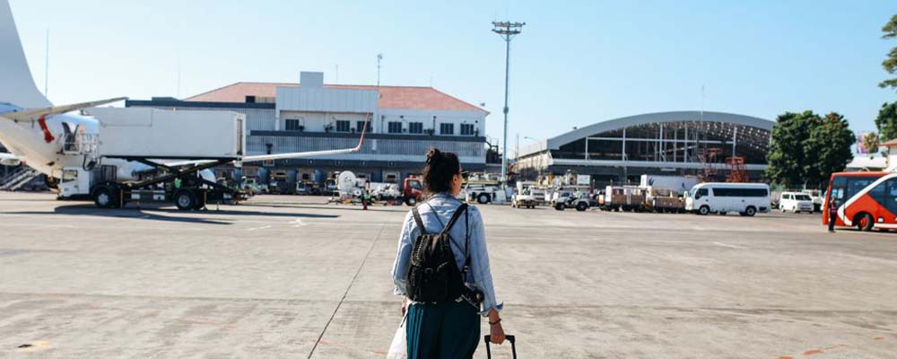 Person walking on the tarmac of an airport